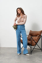 Лонгслів з драпіруванням і золотою деталлю від KA.EL